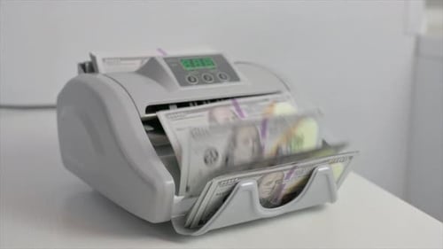 Money Counter Machine Processing Dollar Bills