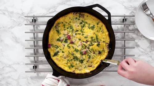 Preparing Delicious Homemade Frittata in Cast Iron Skillet