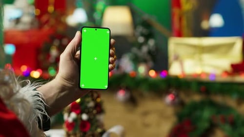 Santa Claus Looking at Letter Received From Kids on Mockup Laptop