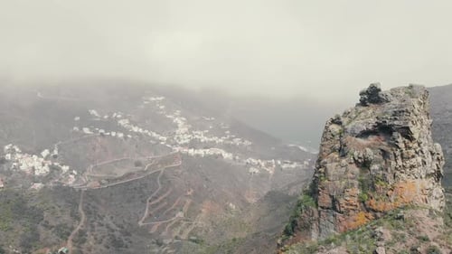 Flight in the clouds in mountains, morning clouds in the mountains aerial, Aerial view above the clo