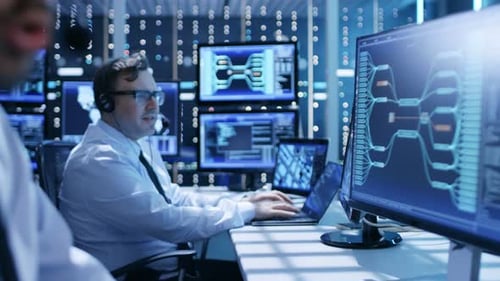 In the System Control Center Technical Support Team Gives Instructions with the Help of the Headset