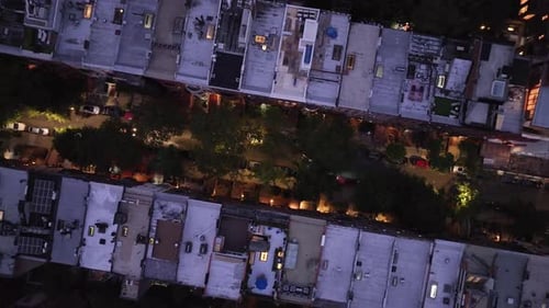Aerial view looking down at a row of Brownstones on Manhattan's Upper West Side at night