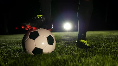 Soccer Player Athlete Training Foot Ball Sport on Soccer Field at Night