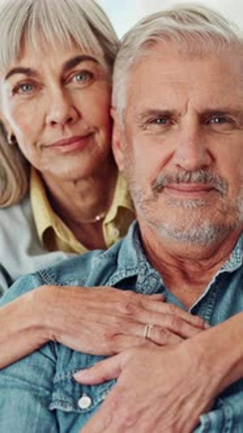 Gray Haired Loving Couple Hugging in Portrait Orientation