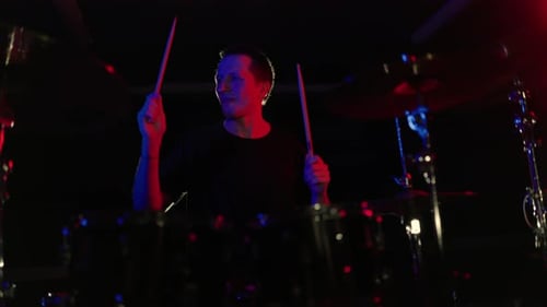 Rock Band Drummer Playing Drums at a Concert
