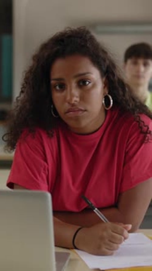 Young Student Girl Listening Teacher at High School Classroom Lesson