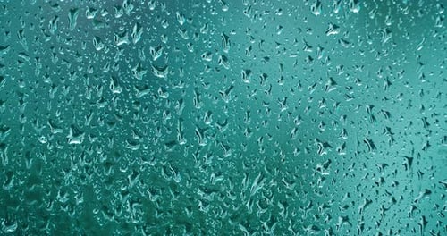 Rain Drops Flowing Down Teal Window Texture