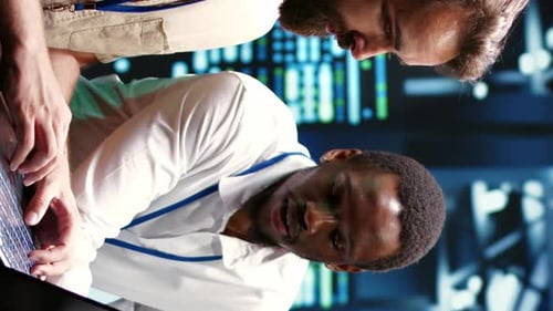 Vertical Video Colleagues Running Data Center Tests