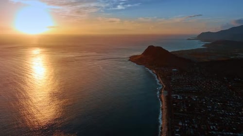 Striking view of sunset above the Pacific Ocean. Drone footage at the shore of Honolulu, Hawaii, USA