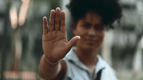 Close-up of woman hand Signaling STOP with Raised Hand, Expressing Refusal