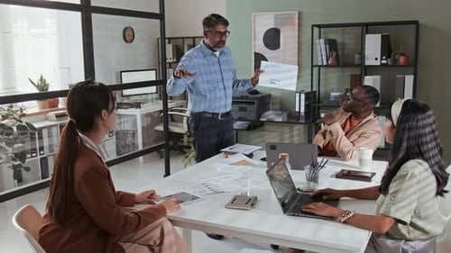 Business Team Meeting Presentation in Modern Office