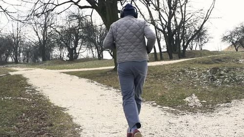 Male Jogger Running In Park, Super Slow Motion 120fps