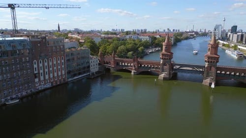 Summer day east west Berlin Border River Bridge Germany. Best aerial top view flight descending dron