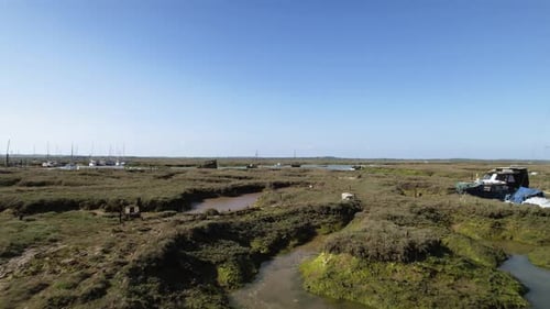 Shipwreck in Swamp Marshes on River Blackwater near Tollesbury Marina, Essex, UK - Aerial Drone Flig