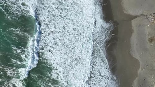 Beautiful Summer Beach in a Storm and White Sea Foam