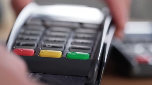 Man hands use bankcard in wireless payment transaction close up