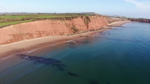 Aerial View Of Orcombe Cliff Coastline On Sunny Day. Establishing Shot