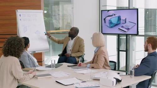 Wheelchair User Conducting Seminar among His Co-Workers