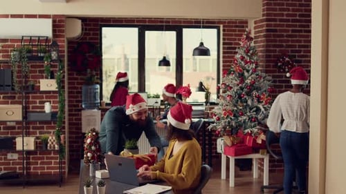 Festive People Exchanging Presents in Decorated Office