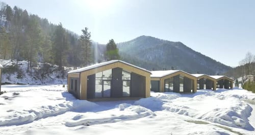 Snowy Cabins in a Winter Mountain Resort