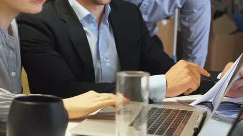 Male and Female Hands of Professional Managers Examining Statistical Data Information at Office