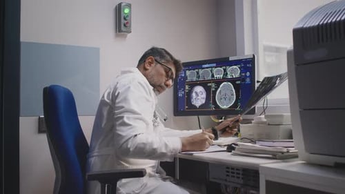 Radiologist Analyzing MRI Scans and Detecting Diagnosis
