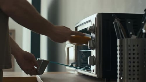 Food Placed in Toaster Oven in Home Kitchen
