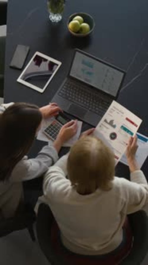 Women Reviewing Financials at Home