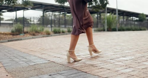 Closeup, business and woman with legs, walking and outdoor with dress and high heels