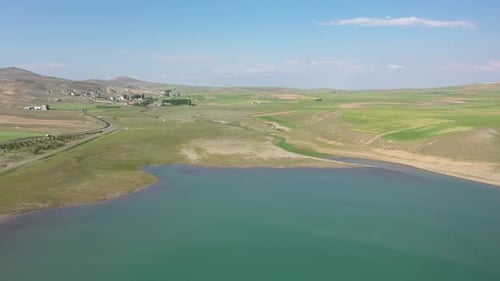 Aerial View Of Lake Farmland And Road