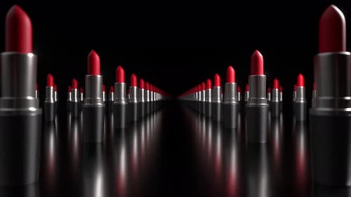Mehrere rote Lippenstifte in silbernen Röhrchen drehen sich langsam gegen eine schwarze reflektierende Oberfläche und erzeugen eine
