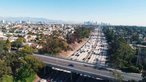 Aerial Los Angeles Freeway Traffic Jib Shot Rising Driving California City Drone