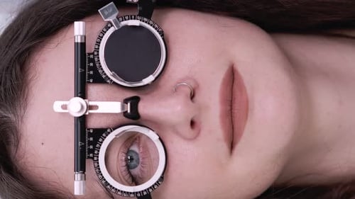 Woman Receiving Eye Exam Close-up, Medical Care