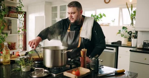 Man Cooking Food in Kitchen
