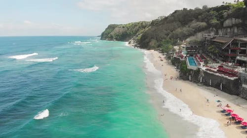 Aerial View of Ocean with Turquoise Lagoon Sandy Beach and Mountains Covered Green Plants Amazing