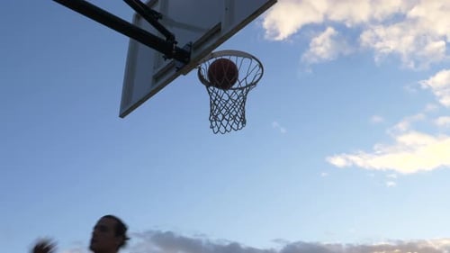Man Does Slam Dunk on Outdoor Court