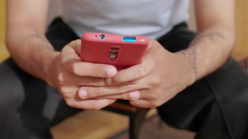Close Up View of Young Man Using Smartphone for Communication