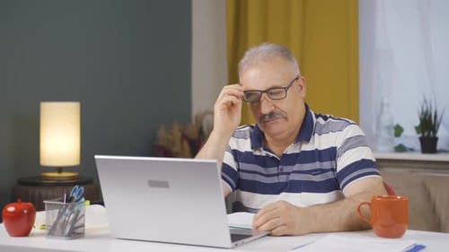 Home office worker old man thinking about private life problems.