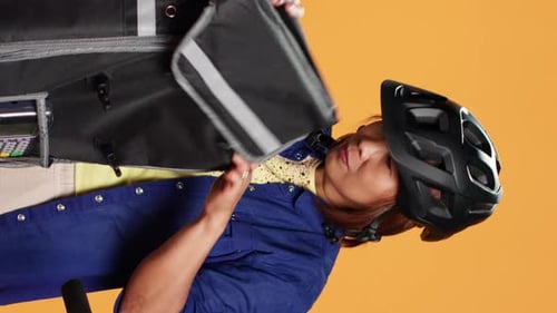 Woman With Delivery Bag Shows Payment Terminal