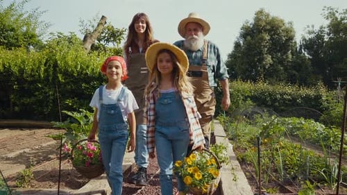 Happy family in a vegetable garden