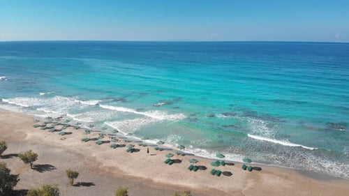 Scenic view of umbrellas at sea coast on sunny day