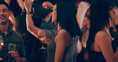 Enthusiastic Group Dancing at a Party at Night