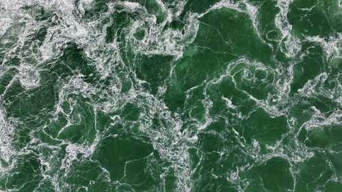 Dynamic Aerial View of Green Ocean Water Surface