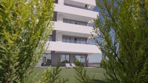 Modern architecture building geometric shapes white surface, blue sky and green lawns and trees
