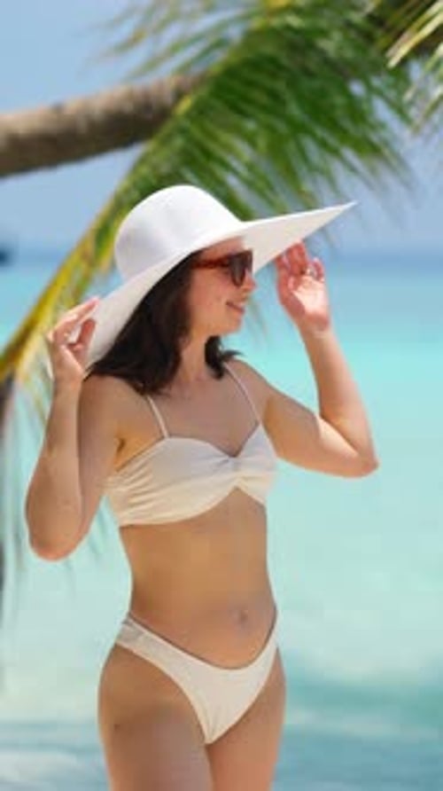 Portrait Young Woman in Big White Hat Relax on Summer Resort Woman Smiling on Sandy Beach in Bikini