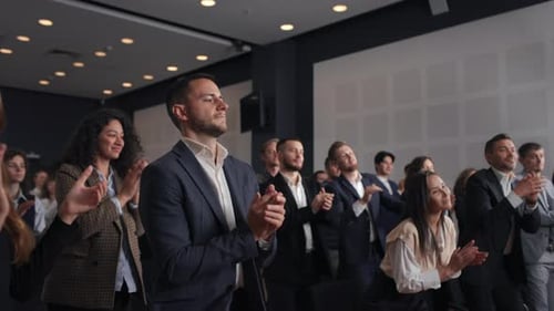 Group Of People Applauds To Speech At Business Conference. Stage Talk At Summit Meet In Crowded M...