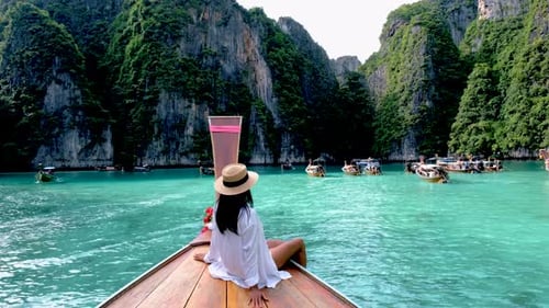 Asian Thai Women in Front of a Longtail Boat at Koh Phi Phi Island Thailand Pileh Lagoon
