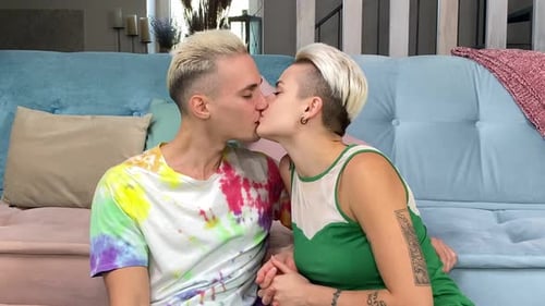 Romantic Couple Sharing a Kiss Indoors