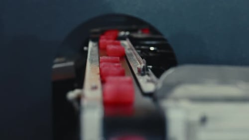 Red Cubes Moving on Automated Conveyor Belt