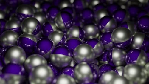 Colored metal balls move in stream